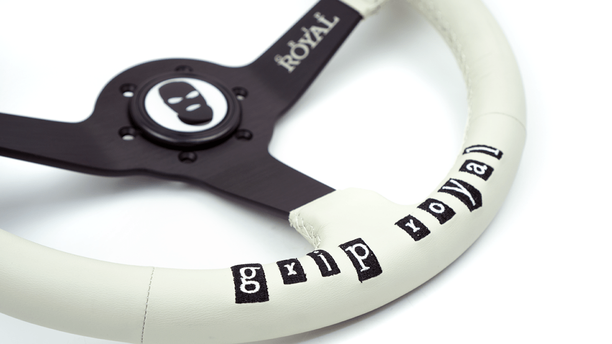 Grip Royal Brute Steal This Wheel! 350mm Deep Dish Steering Wheel w/ White Leather Grip, White Stitching, and Black Embroidery - GRSW - BRT - L - WH - STEALTHIS - Subimods.com