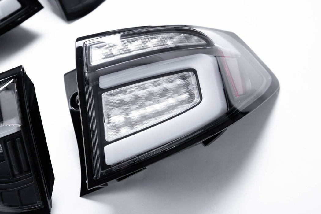 Spyder Sequential LED Tail Lights Black Housing w/ Clear Lens and White Bar 2008-2014 WRX Hatchback / 2011-2014 STI Hatchback - 5086730 - Subimods.com
