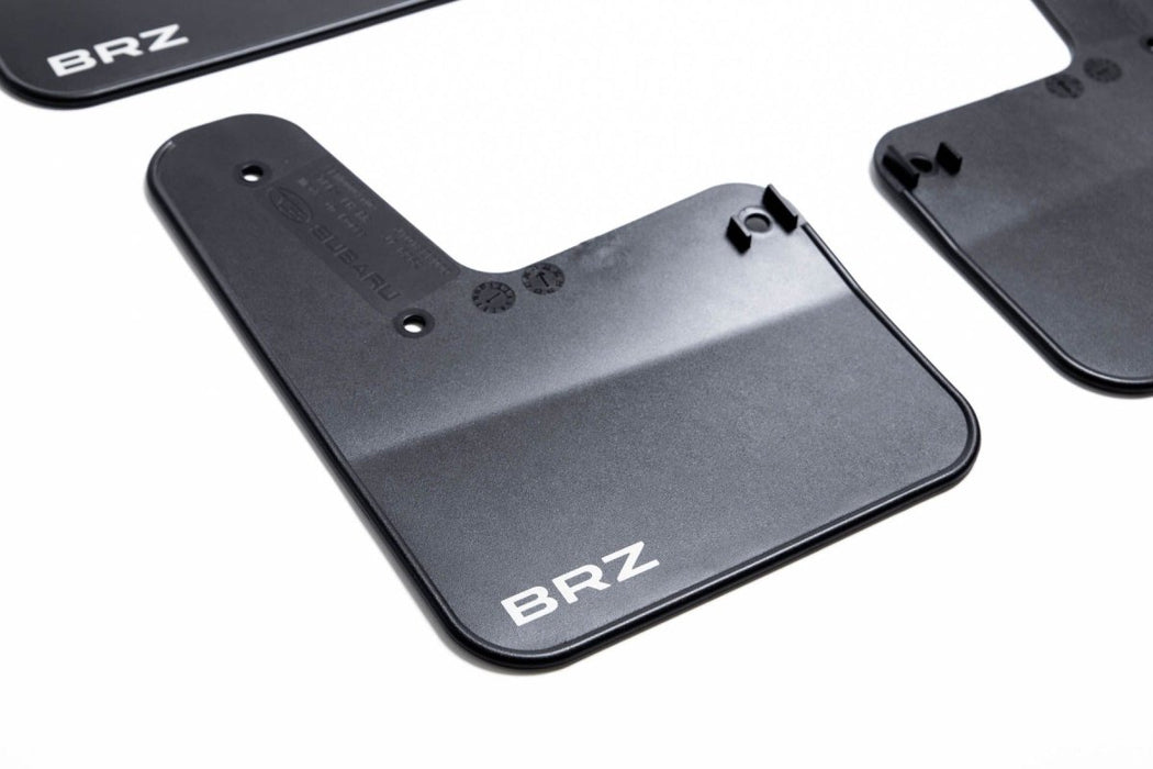 https://subimods.com/cdn/shop/products/subaru-oem-mudflap-set-black-w-white-logo-2022-brz-j101scc000-840824_1050x700.jpg?v=1644331886